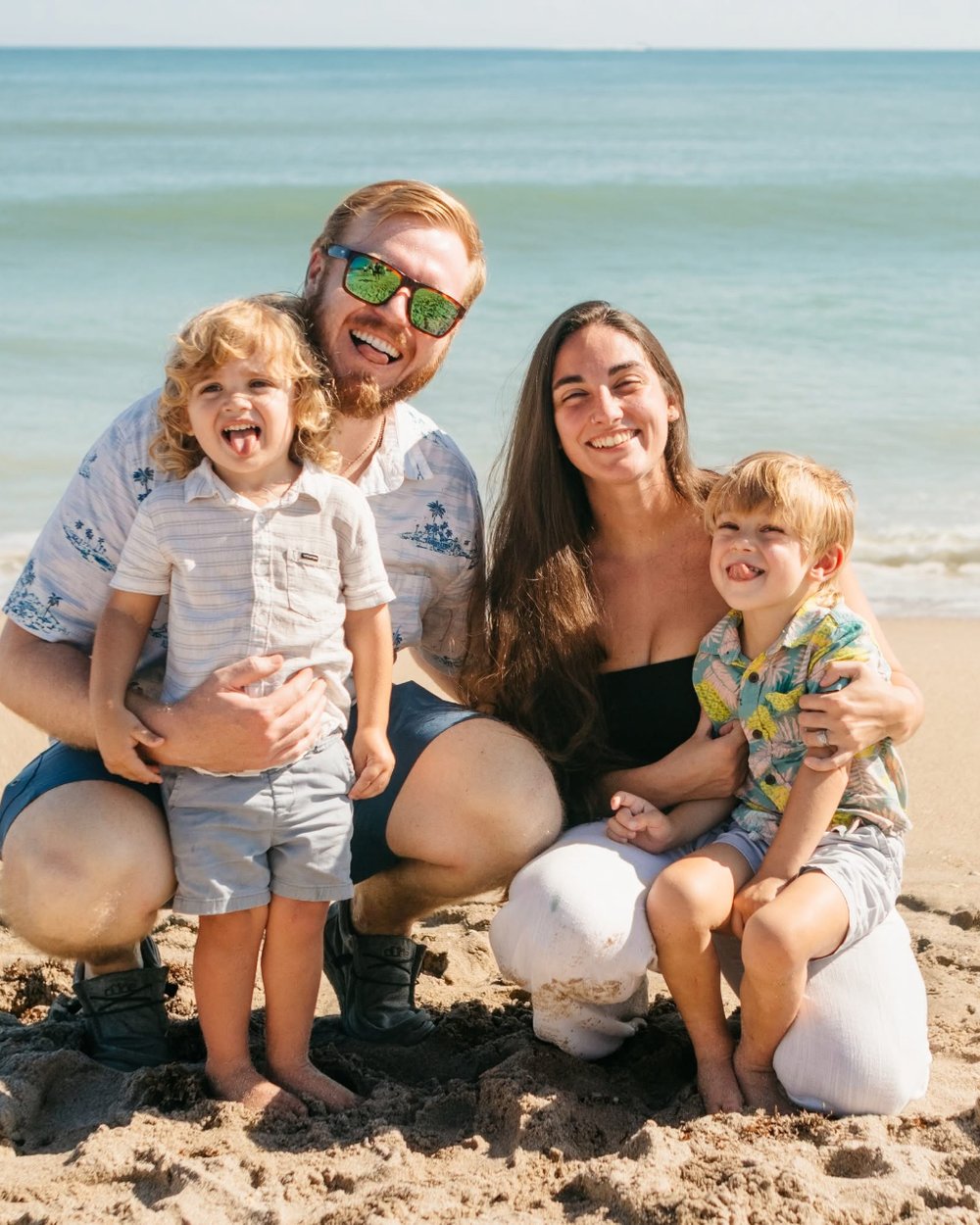Austin Wallen with his wife Samantha and their two sons on the beach in Florida